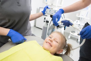 child in a pediatric dentist's chair