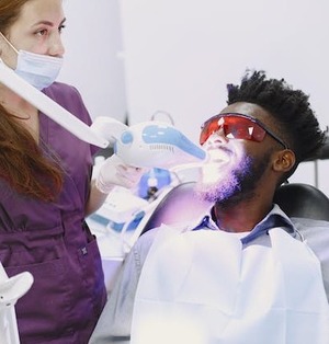 patient getting teeth whitening